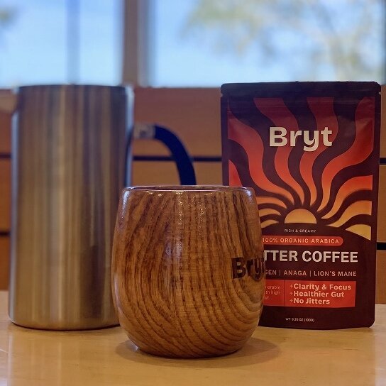 Bryt product beside coffee cup